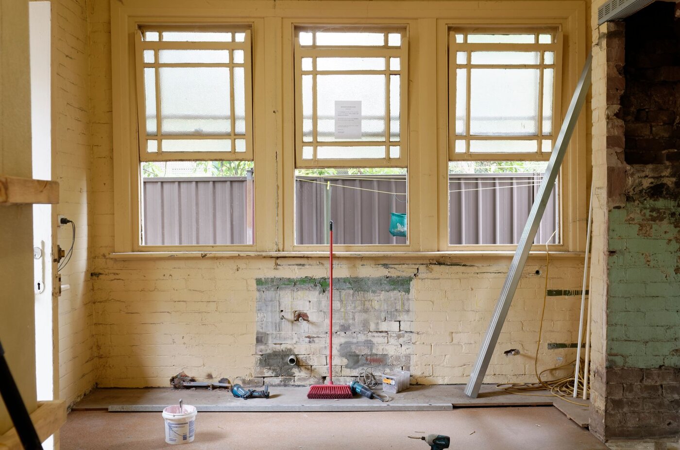 An empty room undergoing renovation, illustrating why an owner may pause property marketing